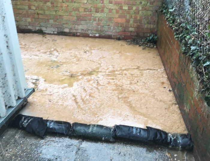 Spilled sewage outside a property